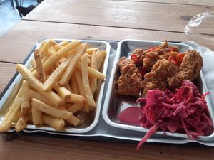 Delicious fried chicken wings and seasoned chips. at Really Happy Chicken in Brighton