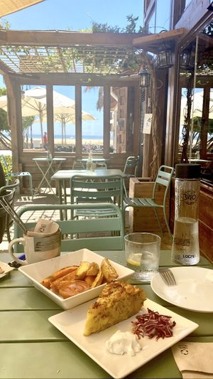 Tortilla de patata y patatas bravas  at Brio in Tarifa