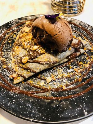 Vegan crepe with chocolate rice milk ice cream, chocolate sauce and peanut praline  at Dine and Dezerts in Brighton-le-sands