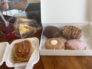 Peach pie, berry ice cream, pizza roll. Donut includes a Boston cream, and cherry almond, Samoa, and peaches and cream.   at Joyfully Baked in Gainesville
