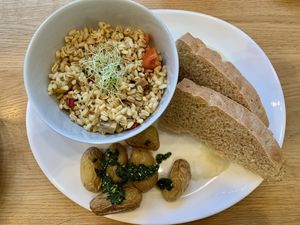 Brunch plate composed of Roasted potatoes with pesto, focaccia with garlicky mashed cauliflower and ebly tomato & chesnut salad. #Veganuary at Carli's Coffee in Echternach