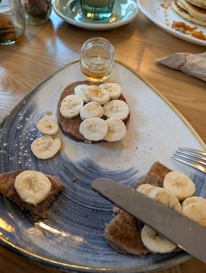 Already half eaten.. oops! You get 4 on top of them. With banana and maple syrup. Vegan & gluten free, made of buckwheat. at Carli's Coffee in Echternach