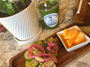 Avocado toast and the green smoothie with cayenne pepper. So good! And Squally’s uses paper straws.  at Squally's Cafe in Las Vegas