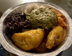 Bowl with black beans, sofritos, plantains, coconut rice and guacamole .  at The Floribbean in St Petersburg