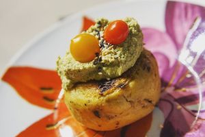 Delicate green plantain bun stuffed with garlicky wild mushroms. Served with Chochos Hummus, a special recipe from the house. at La Suculenta in Guayaquil