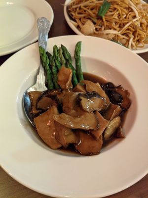 Teriyaki mushrooms with asparagus  at The Orchid Vegan Restaurant in York
