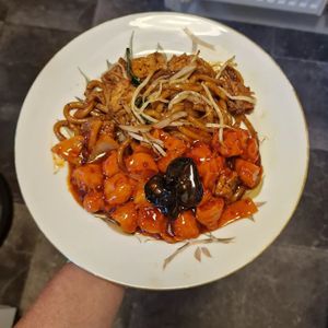 Szechuan chicken and black pepper tofu udon at The Orchid Vegan Restaurant in York