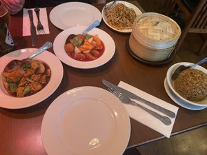 Shitake fried rice, s&s prawn, gyozas, noodles, general tso’s tofu  at The Orchid Vegan Restaurant in York