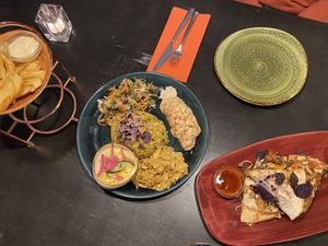 Patatas bravas, jackfruit rendang and quesadillas with vegan cheese and pulled oats! Great!!  at Osorio World's Kitchen in Ameland