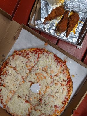 Medium vegan cheese (daiya) pizza and wings at The Wurlitzer Pizza Co in North Tonawanda