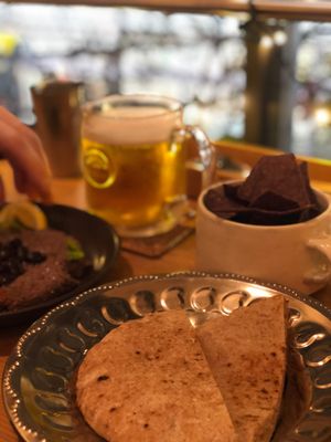 Pita, chips and black bean hummus at Meu Nota in Tokyo