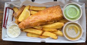 ‘Fish’ & Chips with salt & vinegar and tartare’ sauce. With add-ons (mushy peas and curry sauce). On Fridays ONLY!  (The food is 100% vegan, plant-based, meat-free and dairy-free). 👌 at Seitan Hustle in Fleetwood