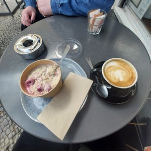Raspberry overnight oats, oat milk cappuccino at Espresso Bar in Berlin