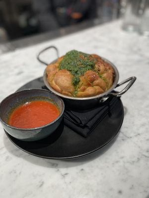 Garlic knot with side of pomodoro. Excellent to share with 3-4 people.   at BAIA in San Francisco