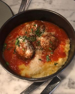 Vegan meatballs with creamy polenta  at BAIA in San Francisco