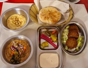 Vegan half breakfast; hummus, falafel, foul madamas, pickles, tahini and pitta at Time Out Cafe in Glasgow