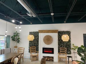 Indoor seating by windows and fireplace  at The InkWell in Littleton