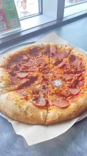 Sausage and pepperoni pizzaa  at Down 2 Earth Plant Based Cuisine in Las Vegas