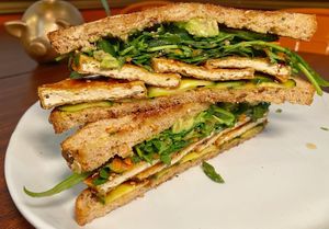 Tofu Teriyaki Sandwich - crispy tofu, cucumber, avocado, cilantro, jalapeno, carrot, green onion slaw at Down 2 Earth Plant Based Cuisine in Las Vegas