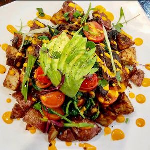 Veggie Hash (GF) - roasted potatoes and yams, sautéed onions, peppers, tomatoes, zucchini, spinach. topped with avocado and vegan cheese
(Weekend Brunch Only) at Down 2 Earth Plant Based Cuisine in Las Vegas