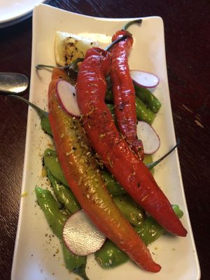 Sweet and spicy grilled shishito peppers at Sprig and Vine in New Hope