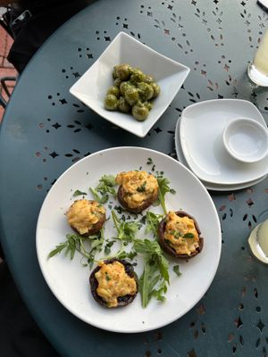 Hearts of Palm-Stuffed Mushrooms (2023) and Castelvetrano Olives at Sprig and Vine in New Hope