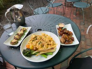 Hearts of Palm-Stuffed Mushrooms, Cauliflower-Cashew Mac, Crispy Smashed Potatoes (2023), left to right at Sprig and Vine in New Hope