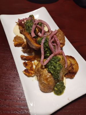 Crispy Smashed Potatoes:
preserved lemon sauce, sumac-marinated red onion, mint-parsley persillade, sea salt at Sprig and Vine in New Hope