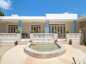 The old animal watering holes was transformed into a water feature that doubles as a drinking fountain for the cats. at Casa Kaan in Merida