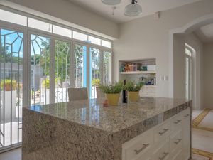 Kitchen in the main house where breakfast is prepared and evening cocktails at Casa Kaan in Merida
