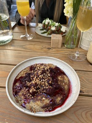 gluten free pancake with berry sauce and crunchy buckwheat sprinkles on top at Etapa in Prague