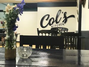 Bud vases and tea light candles on the tables at Col's Kitchen in Concord