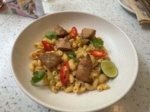 Tom Yum Mac & Cheese with Chickn Pieces  at Nature's Charm in Bangkok