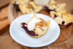 Spiced blueberry pies with whipped vegan cream at Earth Arts & Culture Cafe in Brighton