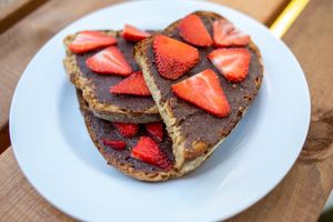 Our homemade vegan chocolate spread with strawberries on toast.  (GF version available) at Earth Arts & Culture Cafe in Brighton