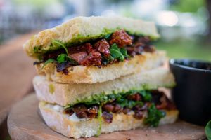 Roasted harissa chickpea sandwich with carrot  bacon and green pesto dressing (GF option available) at Earth Arts & Culture Cafe in Brighton