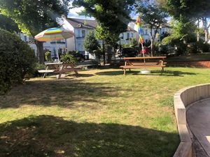 Outside tables at Earth Arts & Culture Cafe in Brighton