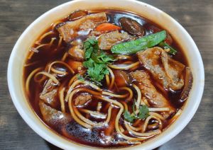 Stewed Mushroom Noodle - 百菇大卤面 at North South East West Fusion Vegetarian Restaurant 东南西北素食融合餐馆 in Central Singapore