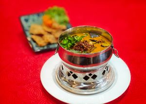 Staple flavors: The Nyonya asam fish in mini hotpot. at North South East West Fusion Vegetarian Restaurant 东南西北素食融合餐馆 in Central Singapore