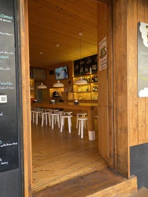 Bench seats and there is another area with tables and chairs   at Taste The Way in A Coruna
