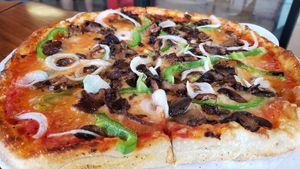 12" build your own w/vegan cheese ($12 + $3.50 for vegan cheese + $2/topping). Pretty good. Cheese was like cheddar mac. Extremely liquid texture though. at Big River Pizza in St Paul