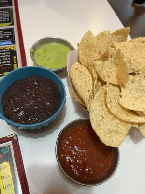 Comp chips with beans, green & red salsa  at Belenty's Love in Fort Worth