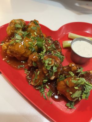 Cauliflower wings- half bbq sauce, half spicy mango sauce  at Belenty's Love in Fort Worth
