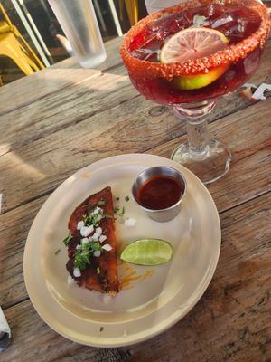 Birria taco & hibiscus agua fresca at Belenty's Love in Fort Worth