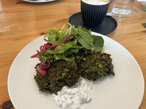Kale pea fritters and soy coffee 👌🏻   at Cafe Stepping Stone in Canberra