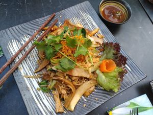 Fried noodles with mushrooms, tofu and greens at Com Chay in Mannheim