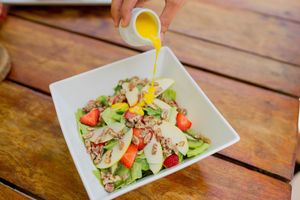 if you are healthy the "lido salad" is the option it has a mixed greens, strawberries, apple, kiwi and caramelized nuts with a mango vinaigrette at Lido Beach Club  in Playa Del Carmen