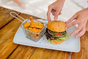 Please try the Portobello Burger it has grilled portobello mushroom topped with lettuce, roasted pepper, purple onion, pesto sauce and vegan ranchero dip. at Lido Beach Club  in Playa Del Carmen