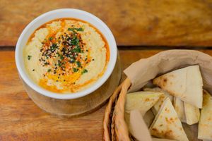 This is the hummus they mashed chickpeas with olive oil, paprika and touch of garlic served with pita bread at Lido Beach Club  in Playa Del Carmen