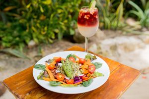 This is Buddha bowl it has mixed greens, spinach, hummus, sweet potato, beet, avocado, whole beans, carrot, cherry tomatoes, red cabbage, radish and pumpkin seeds try it!! at Lido Beach Club  in Playa Del Carmen